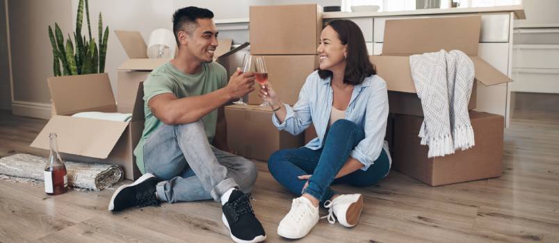 Couple sharing a toast in new house