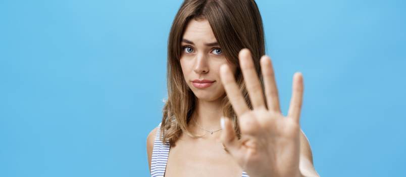 Woman saying no with body language