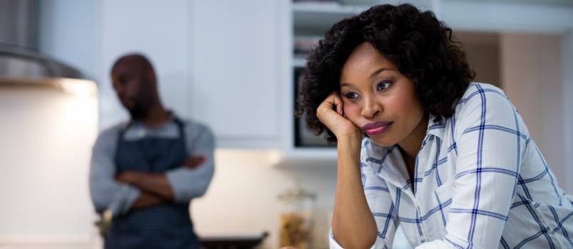 Sad couple in kitchen