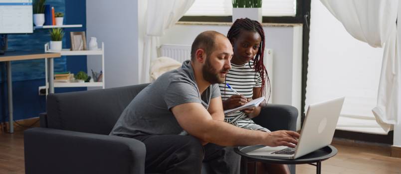 Couple calculating budget for tax payment