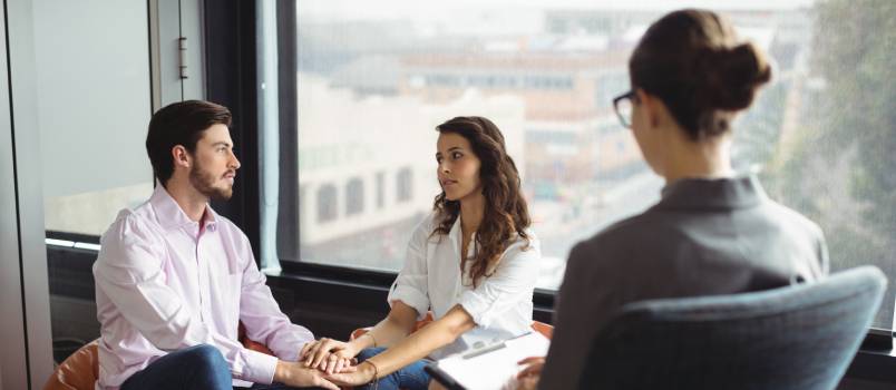 Couple talking to a marriage counselor