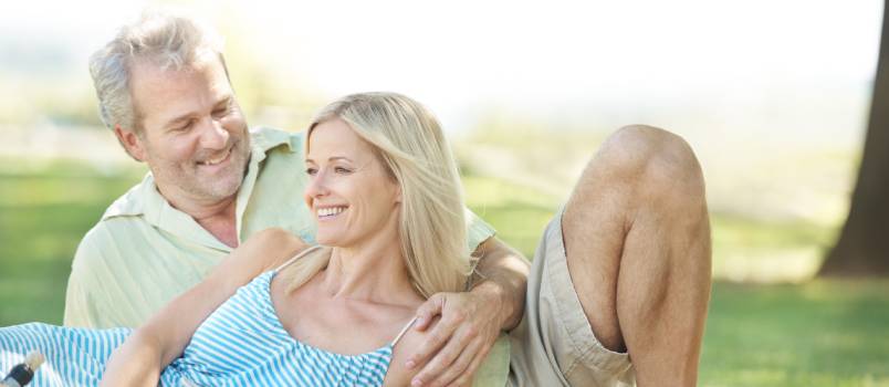Husband and wife enjoying picnic in park