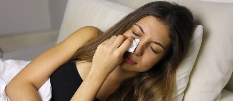 Sad woman crying on bed