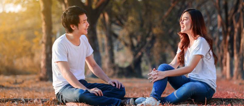 Young couple talking in park