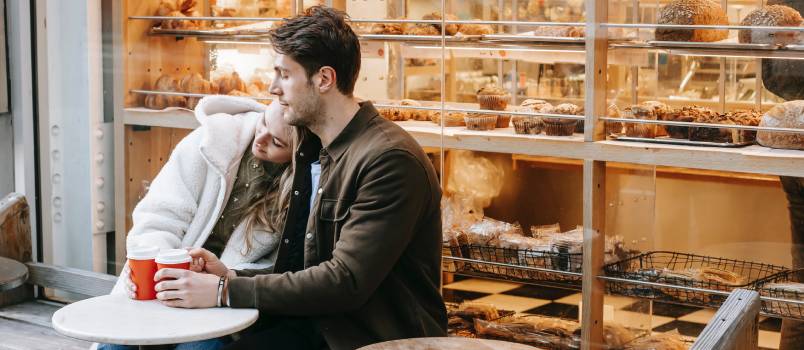 Upset woman with man in cafe