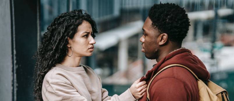 Young couple talking on street