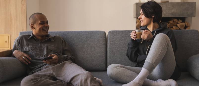 Couple sitting on sofa