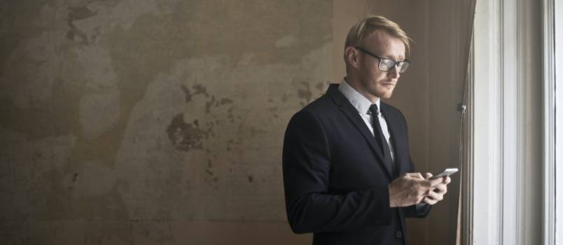 Young businessman using smartphone 