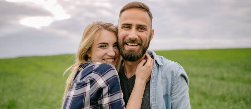 Happy couple in grassland 