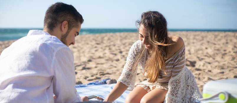 Couple enjoying picnic outside 