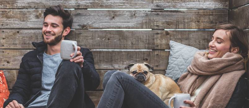 Couple enjoying outside with dog