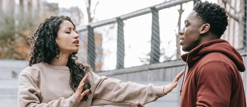 Couple having conflict on street
