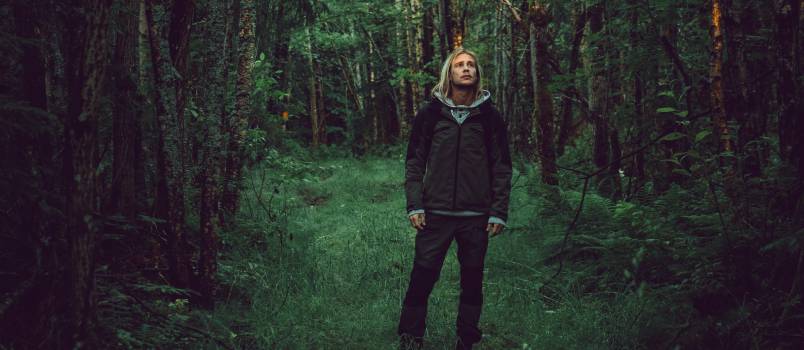 Man standing alone in forest