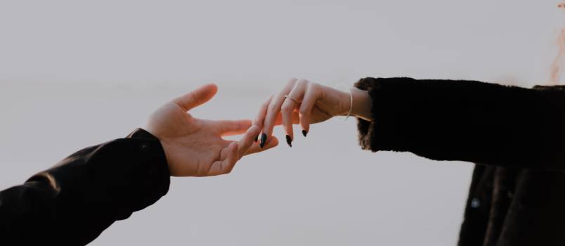 People reaching hands