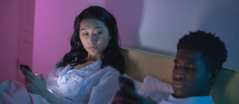 Woman looking at man phone