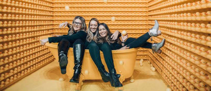 Womans sitting between bath tub