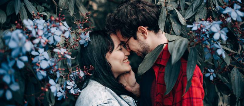 Man and woman standing tree