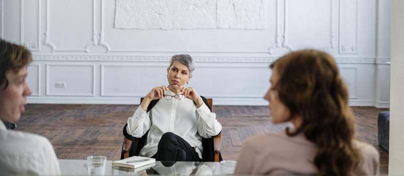 Couple sitting with lawyer