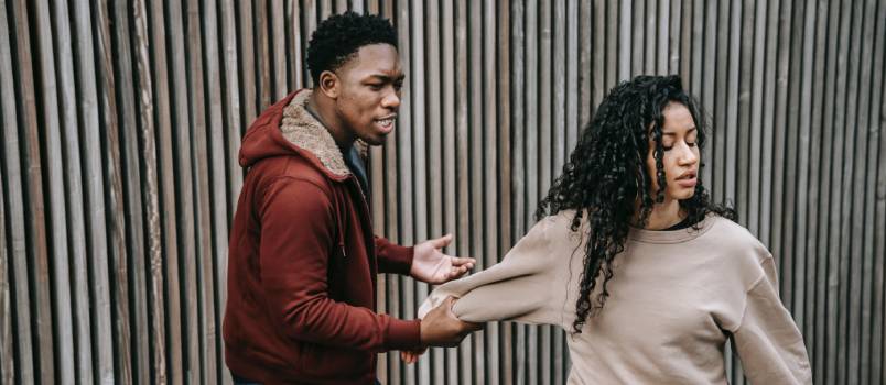 Man being aggressive with woman 