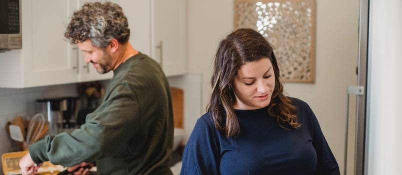 Couple cooking dinner in kitchen