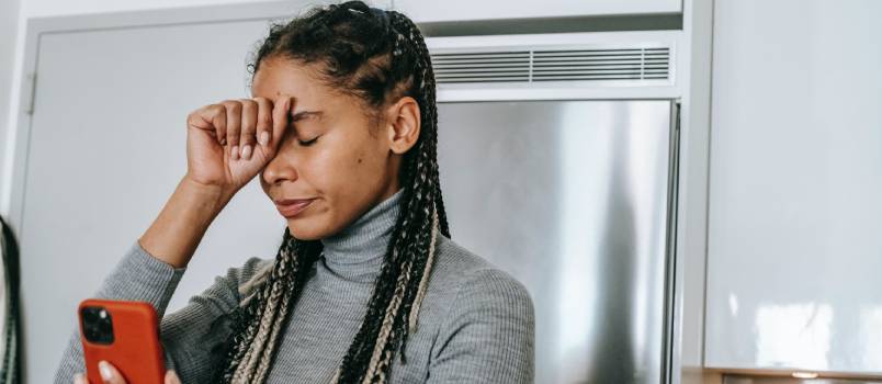 Sad woman arguing on video call