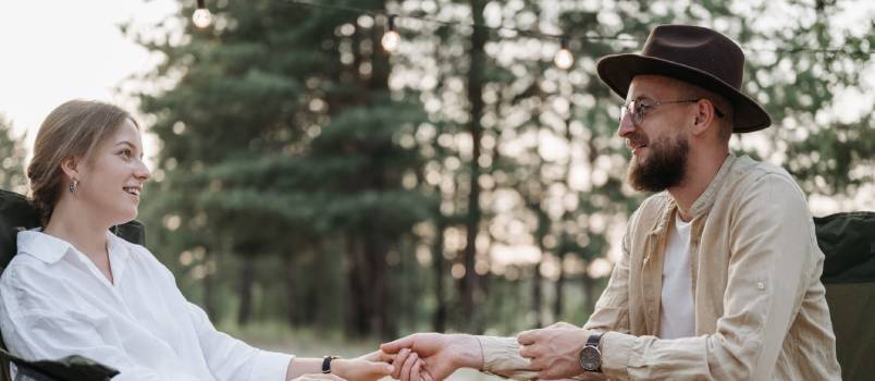 Couple sitting holding hands