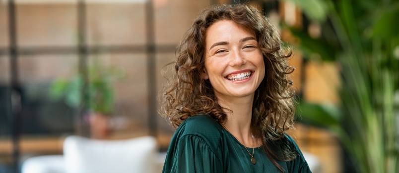 Young woman smiling looking at camera 