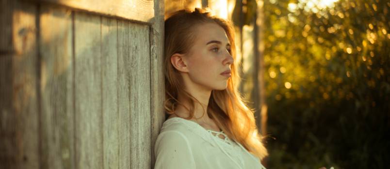Woman laying on wall