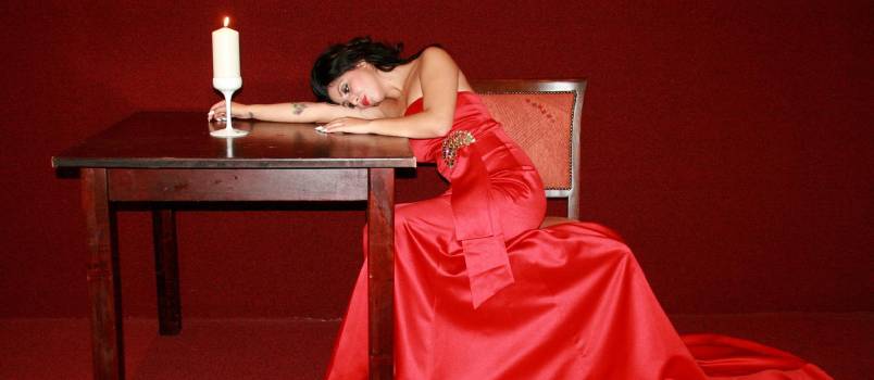 Sad woman laying on table