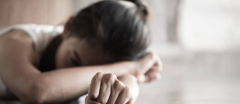 woman laying on table