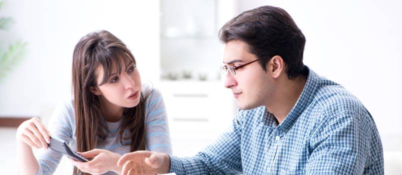 Young couple looking at family finance