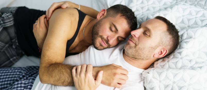 Gay couple sleeping together