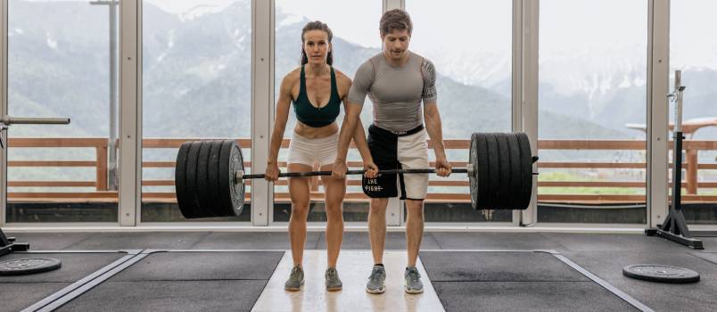 Couple at gym doing workout