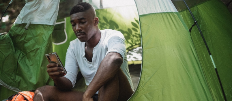 Unhappy man surfing smartphone