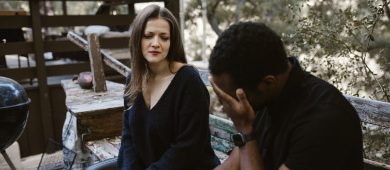 Crying woman looking at man