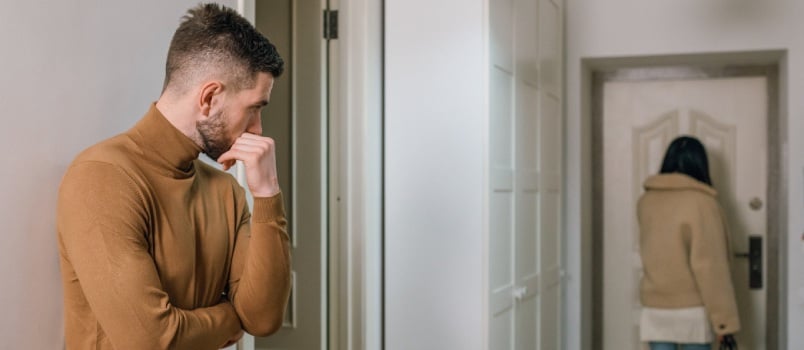 Man looking at woman leaving