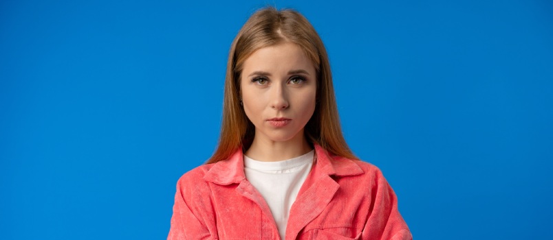 Serious young woman in studio
