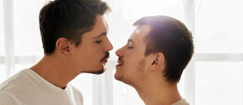 Gay couple kissing each other