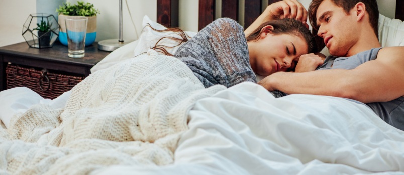 couple laying on bed