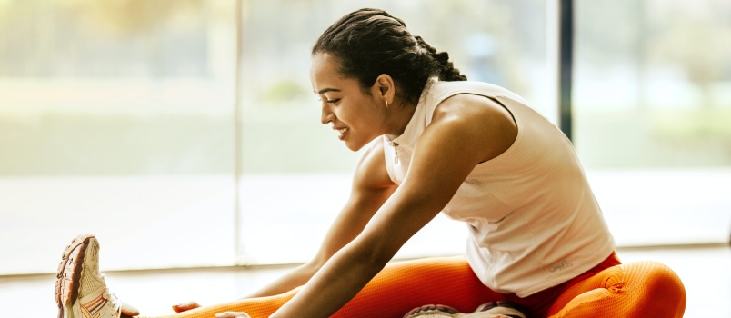 Woman stretching on ground