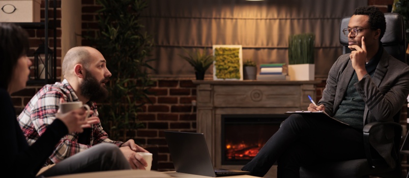 Man having session with therapist