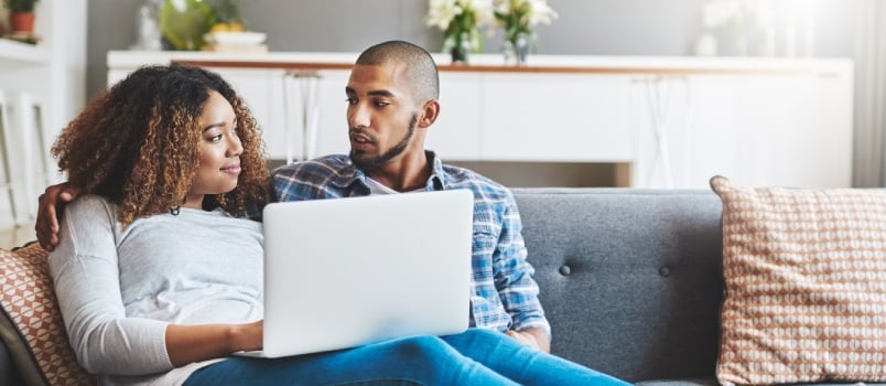 couple relaxing on sofa