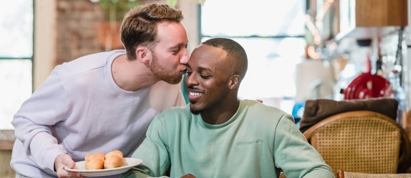 Happy couple enjoying breakfast at home