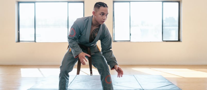 man in grey taekwondo uniform