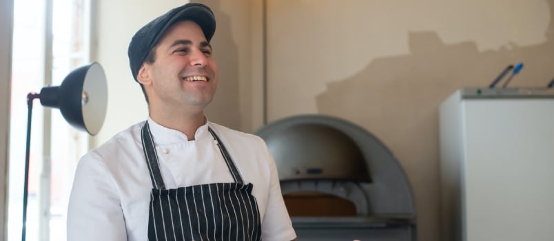 Chief carrying pizza boxes