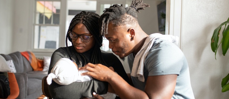 Parents looking at their kid