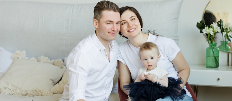 Couple with baby sitting