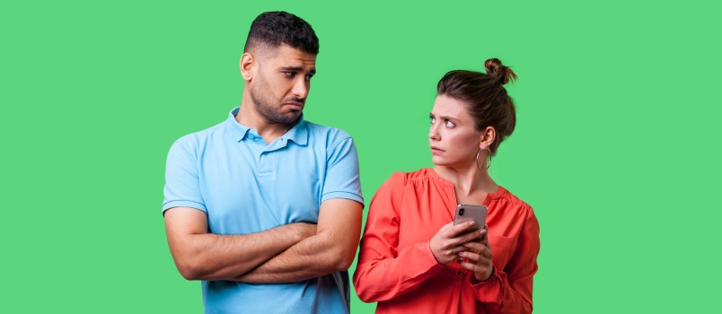 Emotional couple on green background