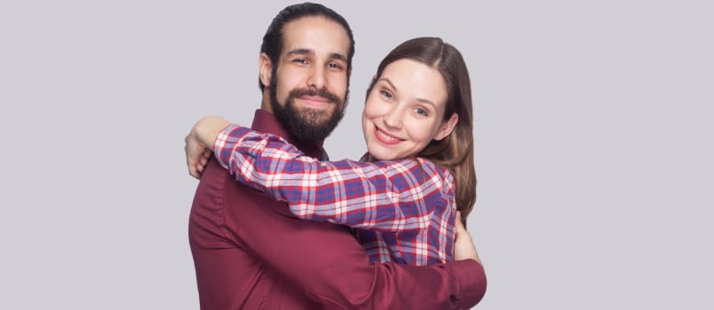 Emotional couple on gray background