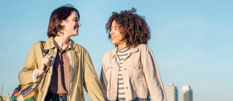 Lesbian couple walking and laughing